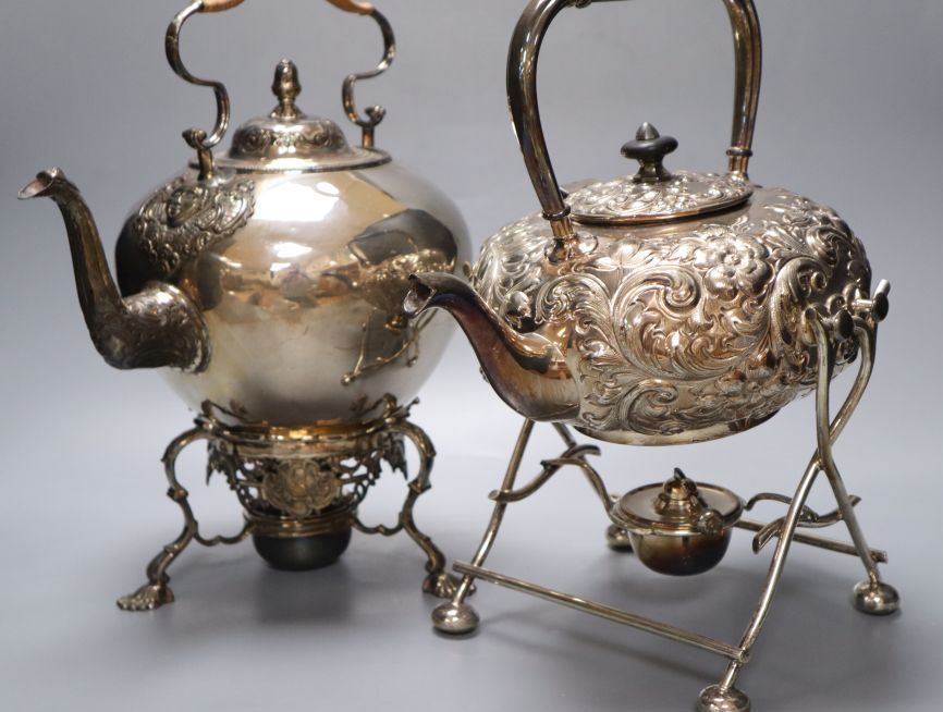 Two Victorian silver plated tea kettles each on burner stands, 34cm high